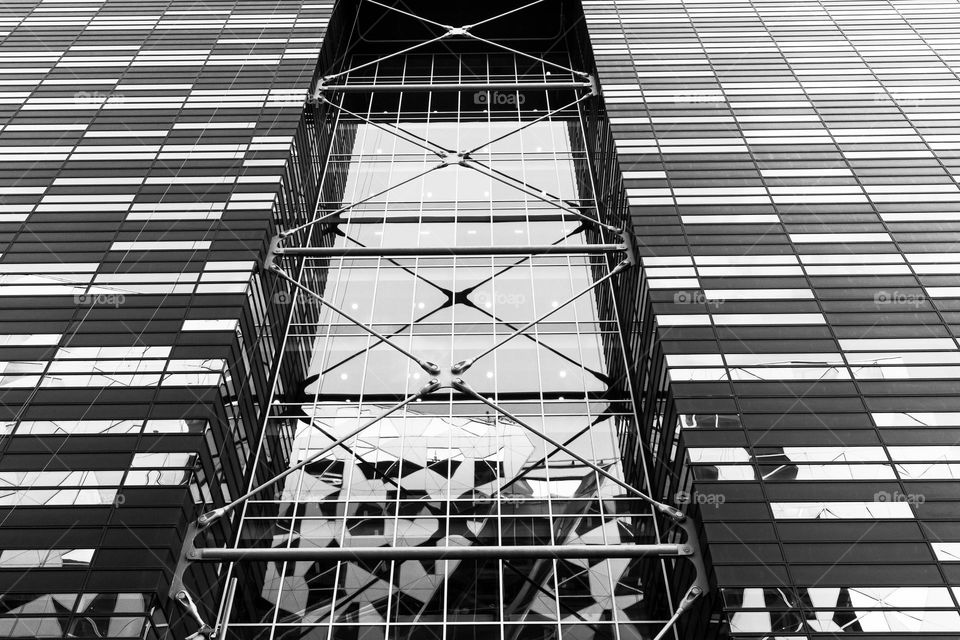 Modern architecture building with glass  geometric facade in b&w 