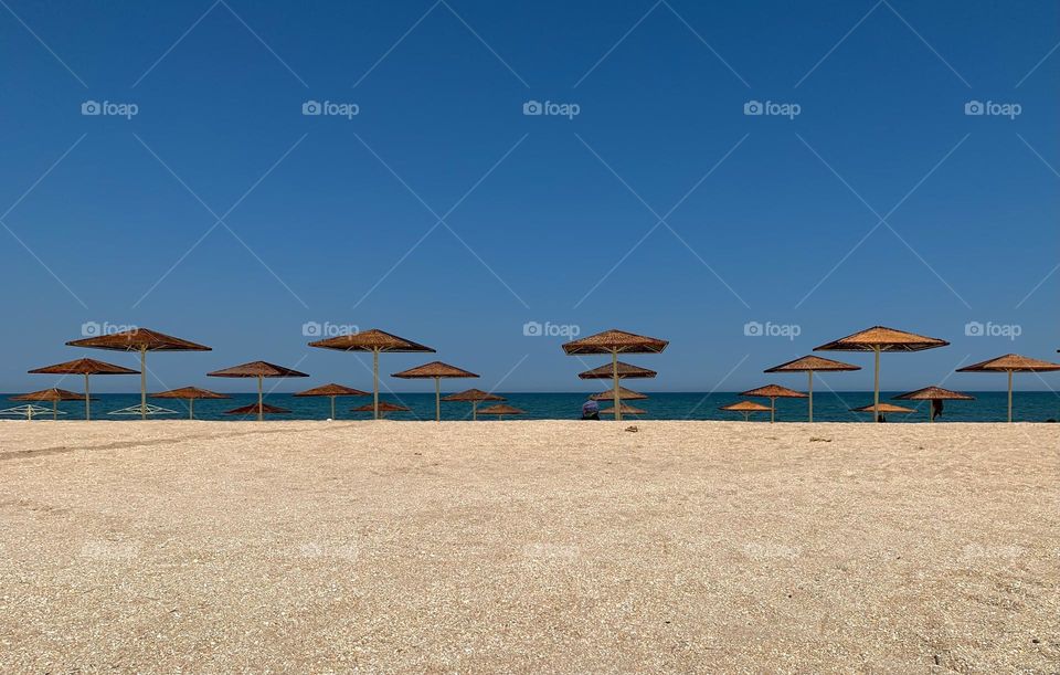 Minimalistic beach, blue sky