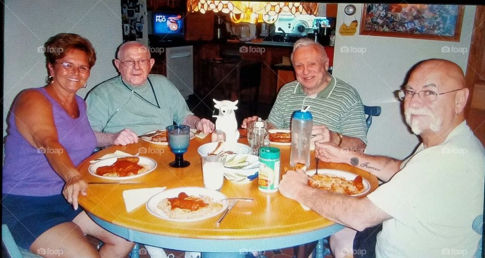 Dinner with visiting daughter and two fathers & bro-in -law. All smiling faces at dinner table.
