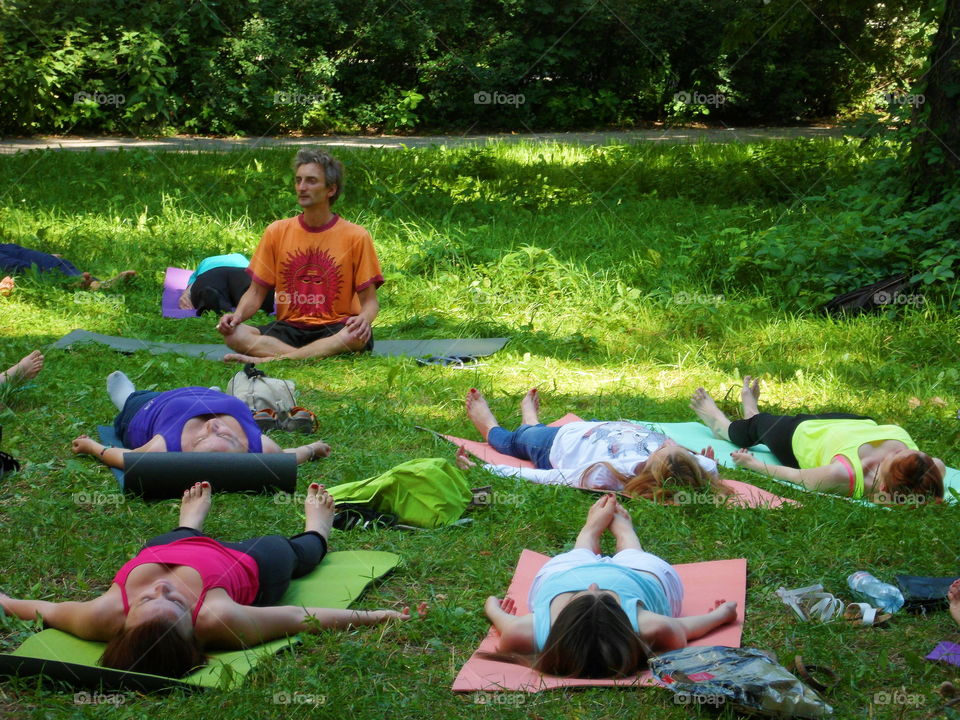 group of people doing yoga outdoors, Ukraine, Kiev