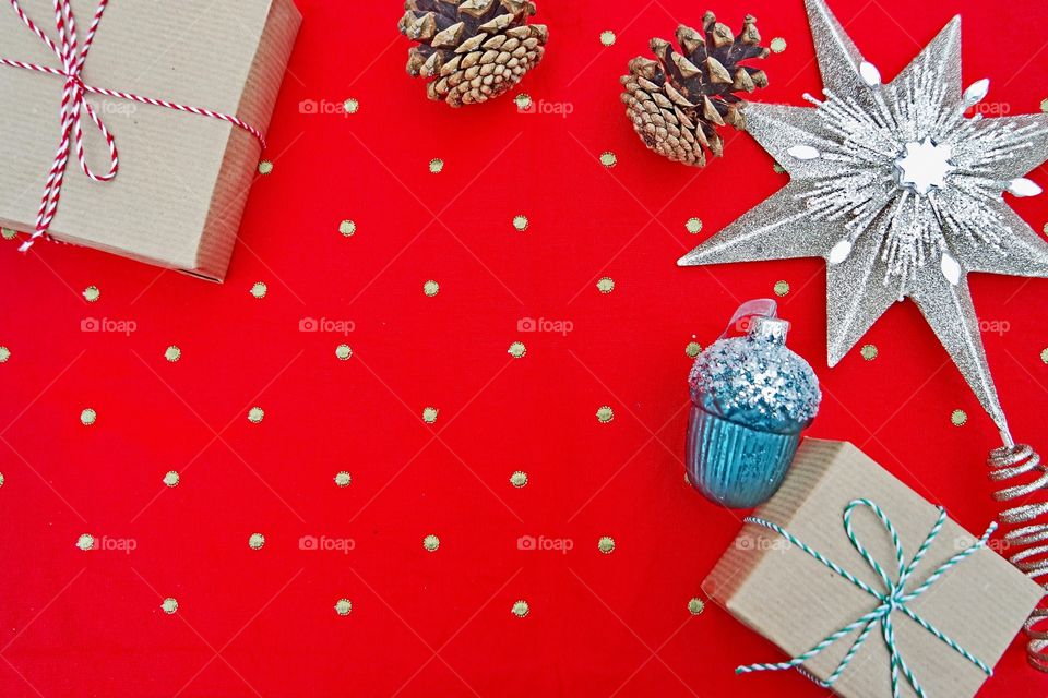 Red polka dots table cloth with Christmas presents and decor background 