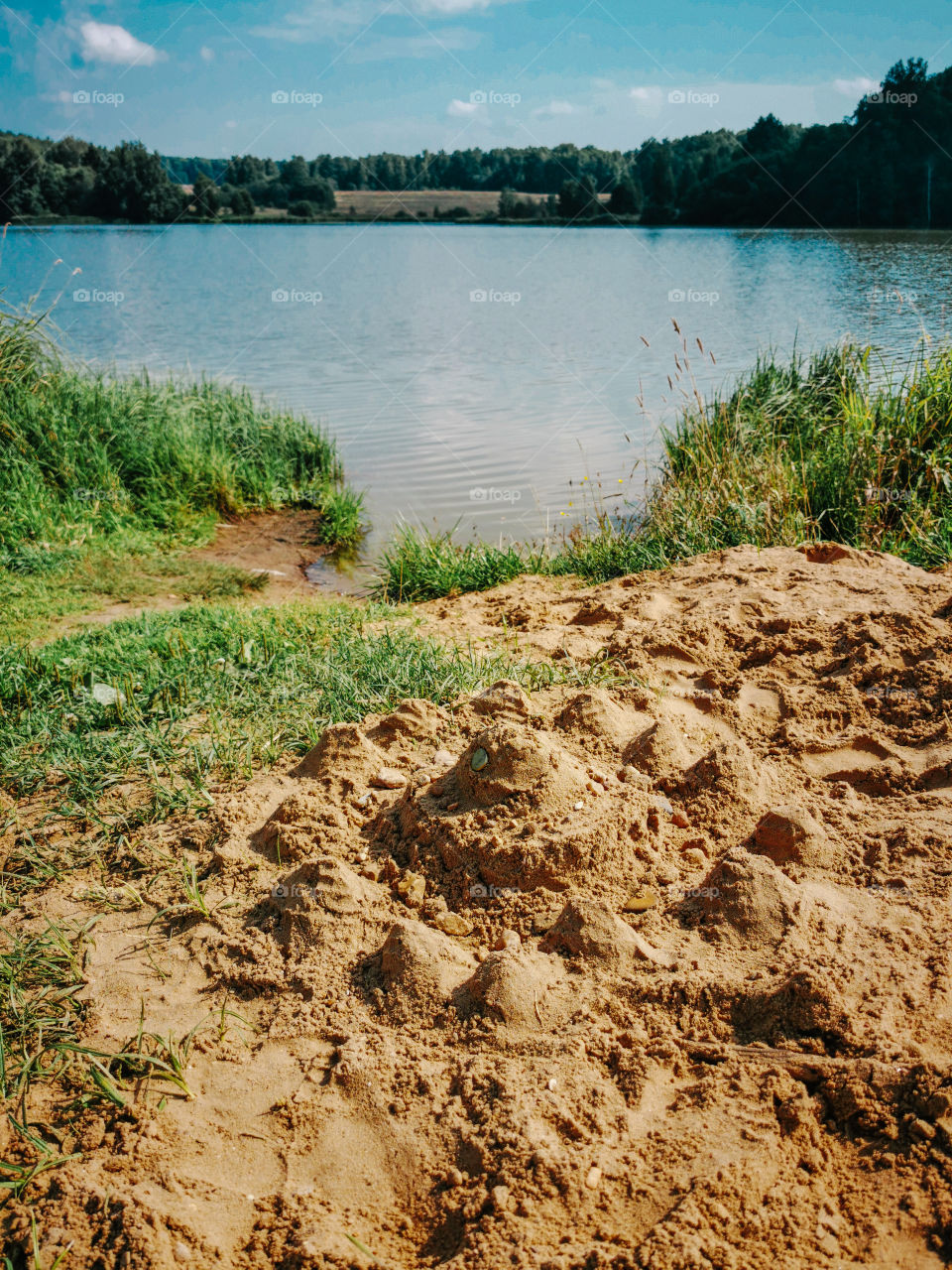 Sandcastle on a lake beach in Russia