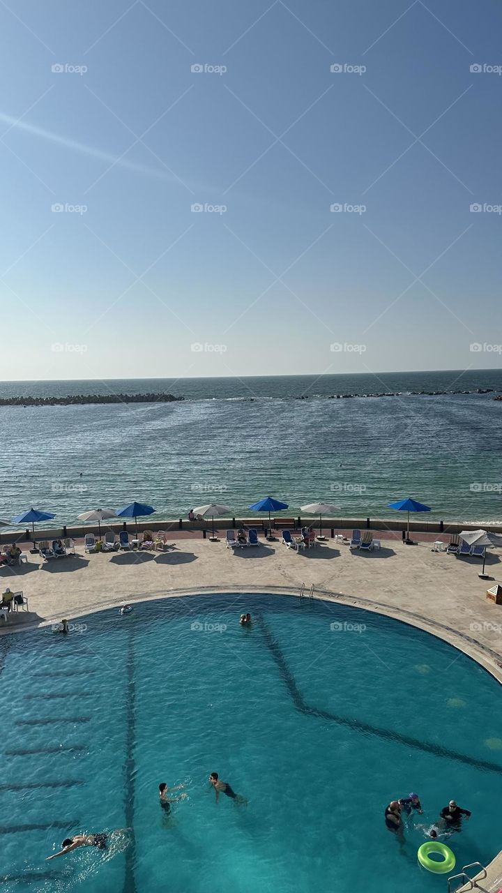 Swimming pool with beach from the top of the building