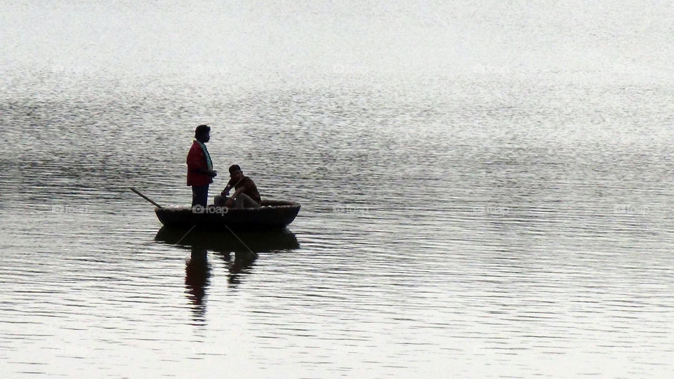 A boat ride in a small circular boat on a calm river.