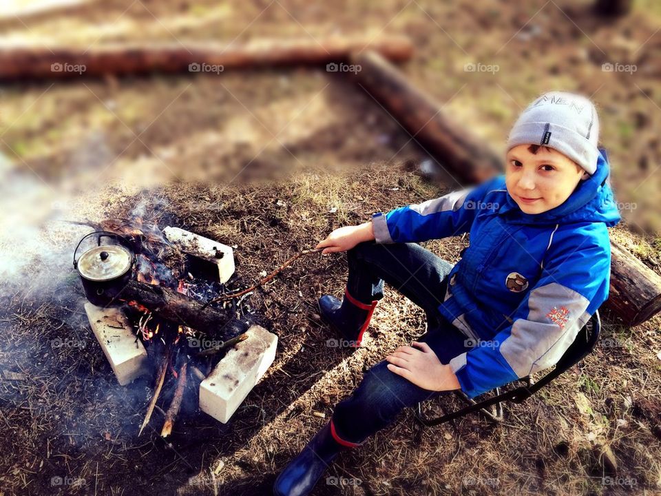 Boy by the fire