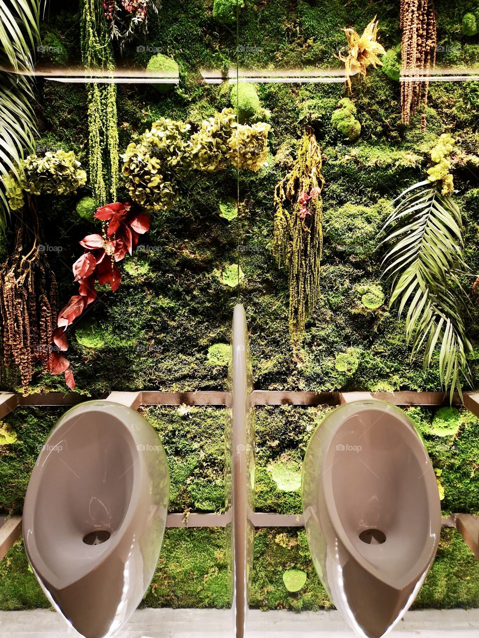 Two male urinal is a garden