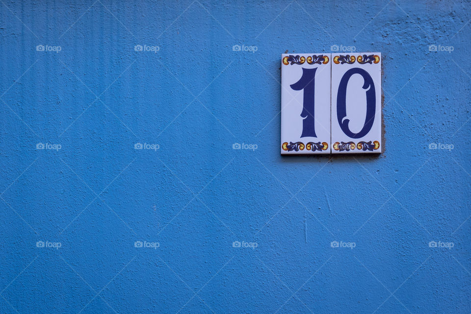 Ten number on blue wall