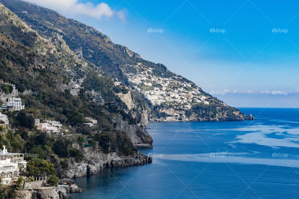 Beautiful view of the mountains on a summer sunny day in the Tyrrhenian sea on the amalfi coast of the island of capri in italy, close-up side view.
