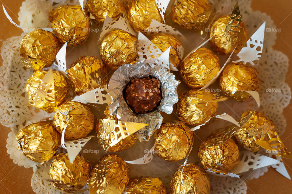 Close up at unwrapped Ferrero Rosher chocolate.