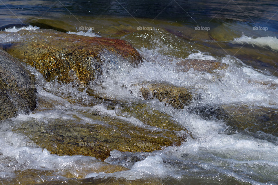 Water flowing on rocky surface