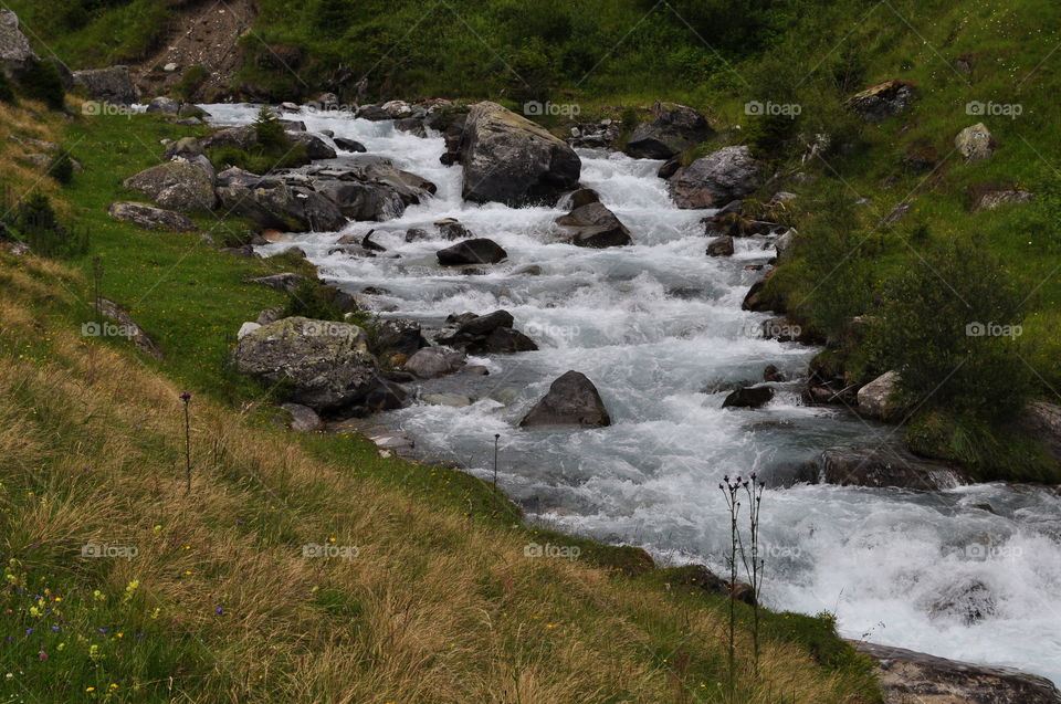 Swiss waterfall. Water is falling from Swiss hills