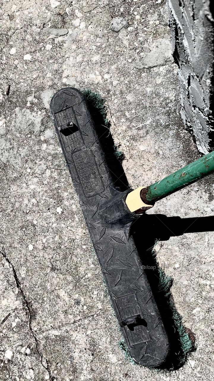 Outdoor Shot Of Long Flat industrial Broom To Clean The Concrete Ground Under Warm Weather