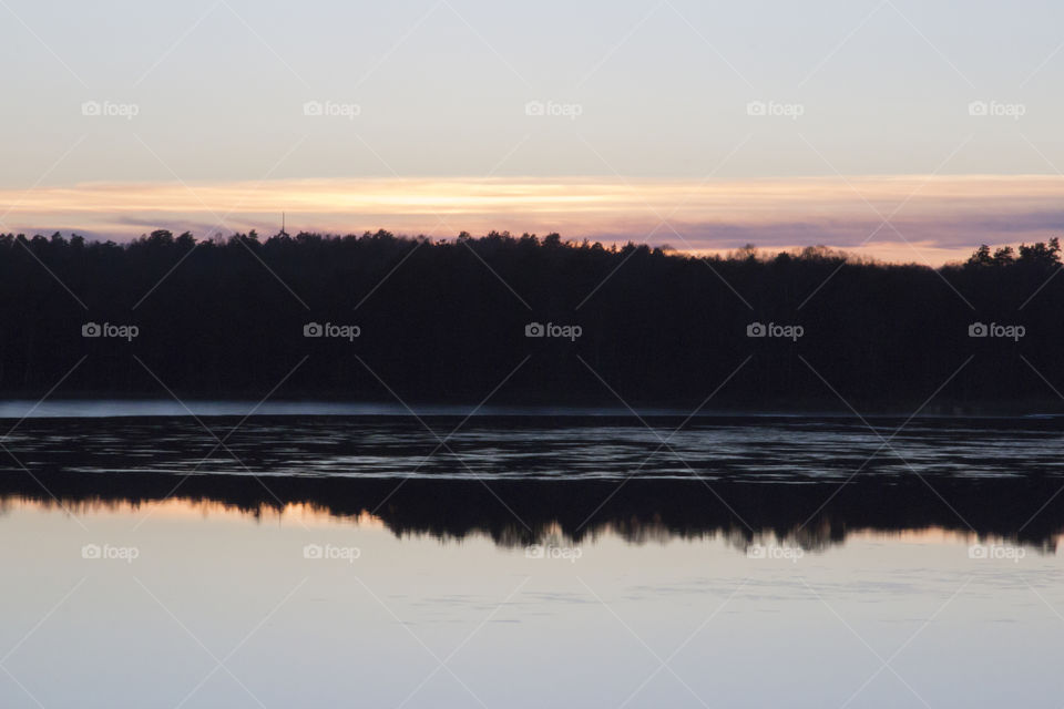 Forest reflections in the lake - sunset 