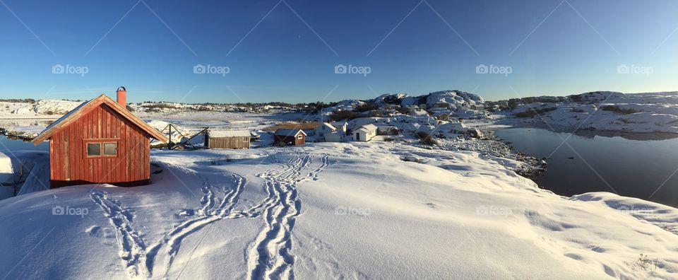 Log cabin and winter landscape