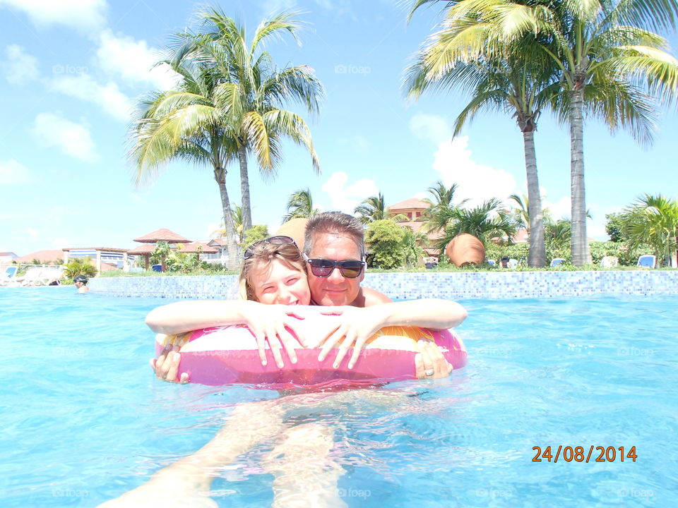 father and daughter in pool
