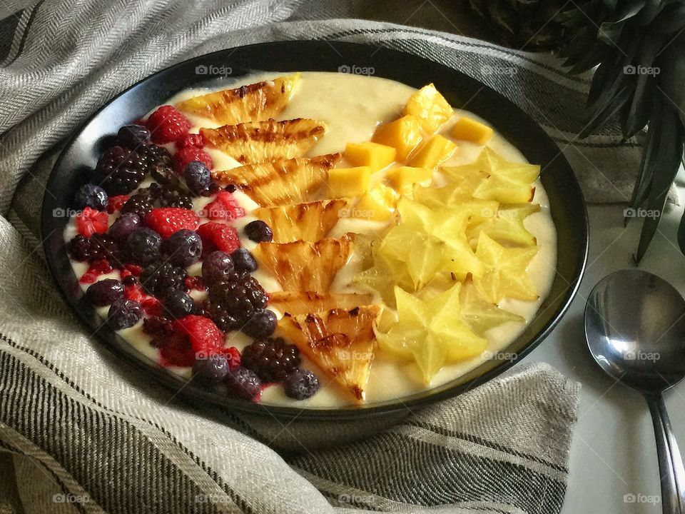 Grilled pineapple mango and Berry smoothie bowl 