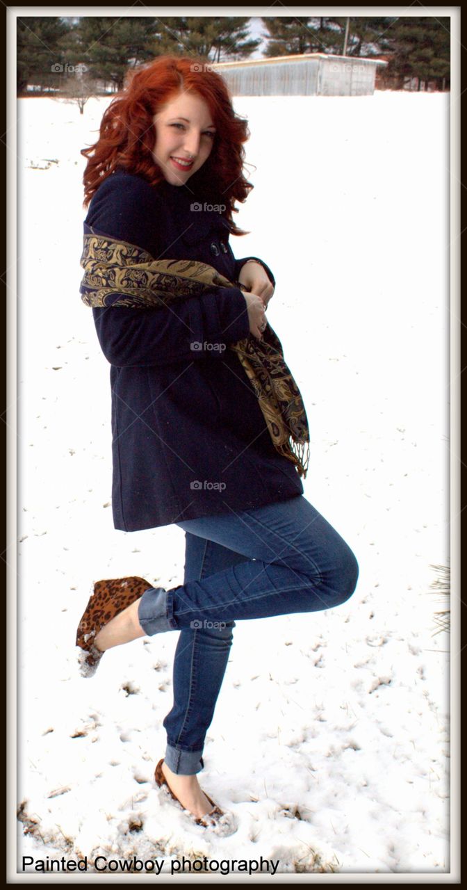 Teenage girl posing in winter