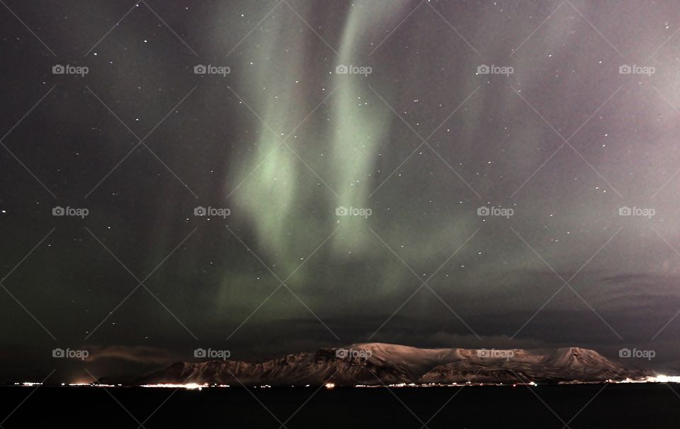 Aurora borealis in Iceland. amazing natural phenomenal. this is taken in the Reykjavik city which has strong light pollution yet the northern light still clearly visible