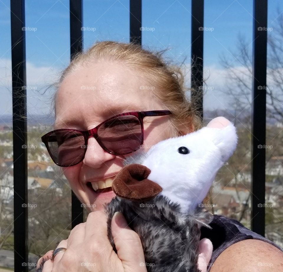 Happy Woman With Stuffed Opossum