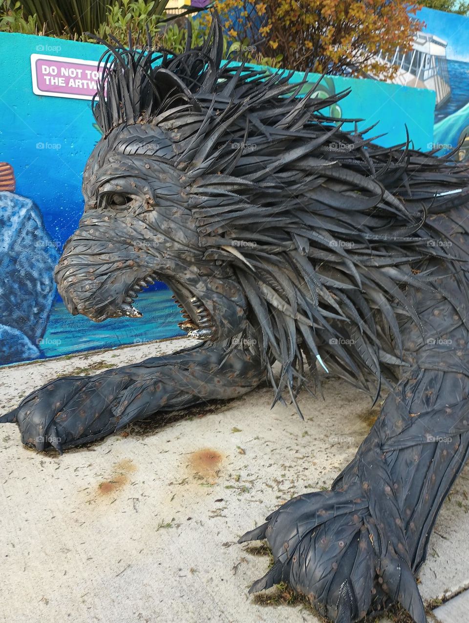 cool lion sculpture made out of old car tires