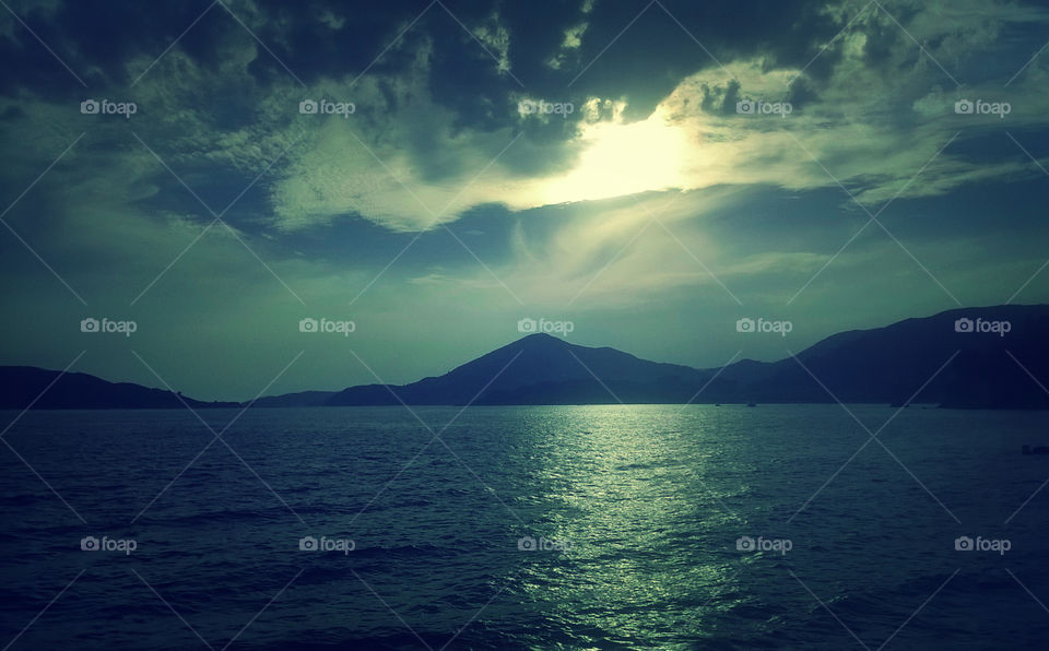 amazing sunset, sea, sky and mountains