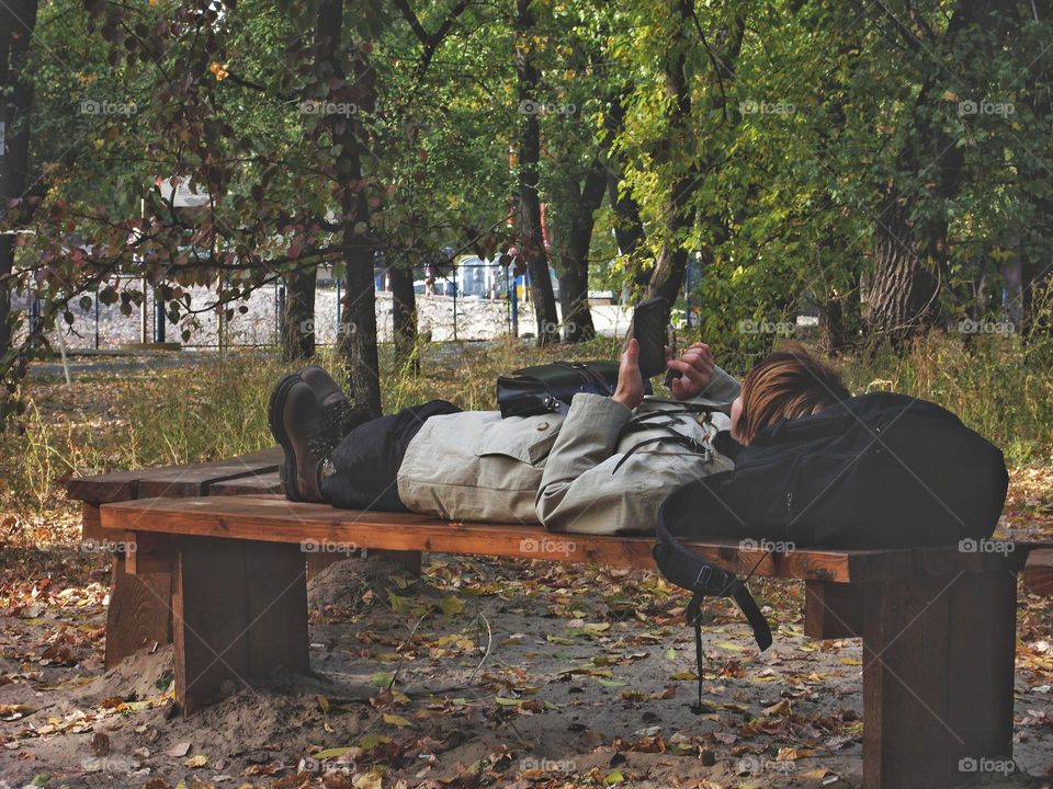 girl resting on a bench