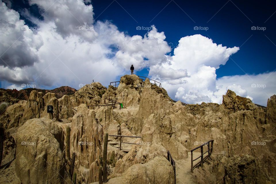 Man on top of a Rocky mountains