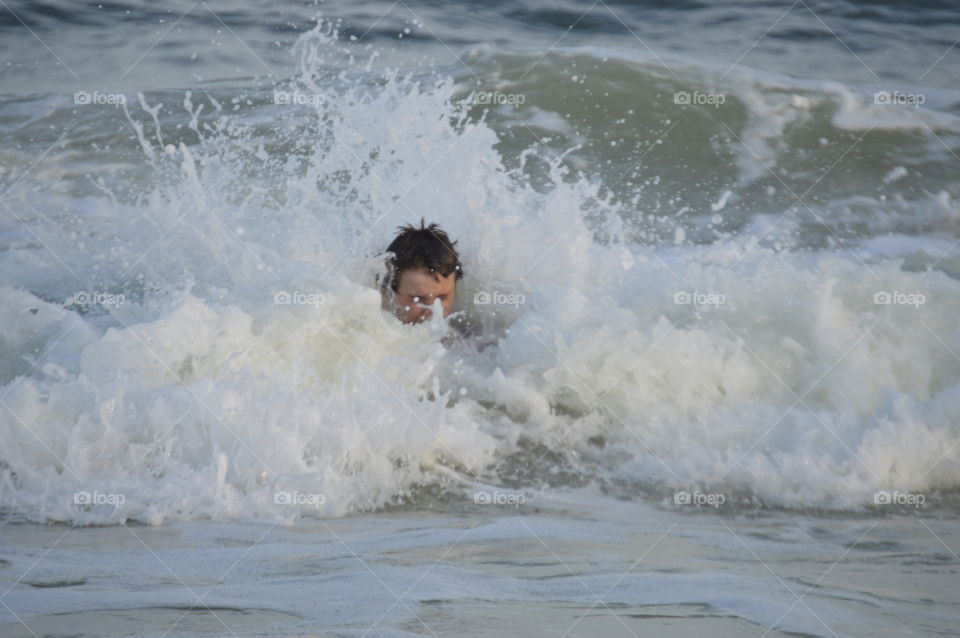 playing in the waves
