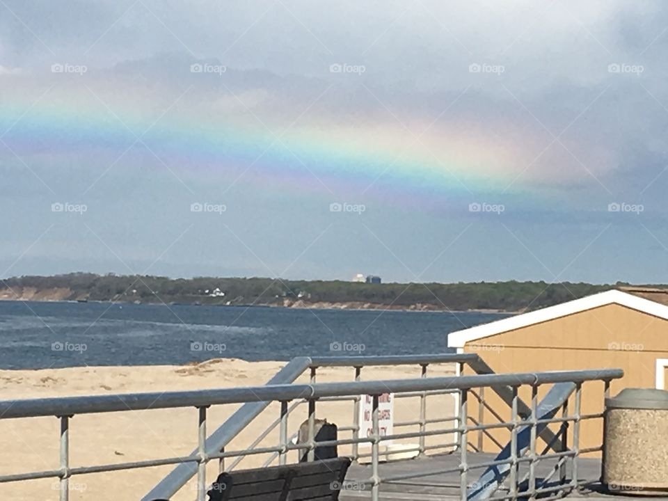 A Rainbow at the beach after a rain storm.