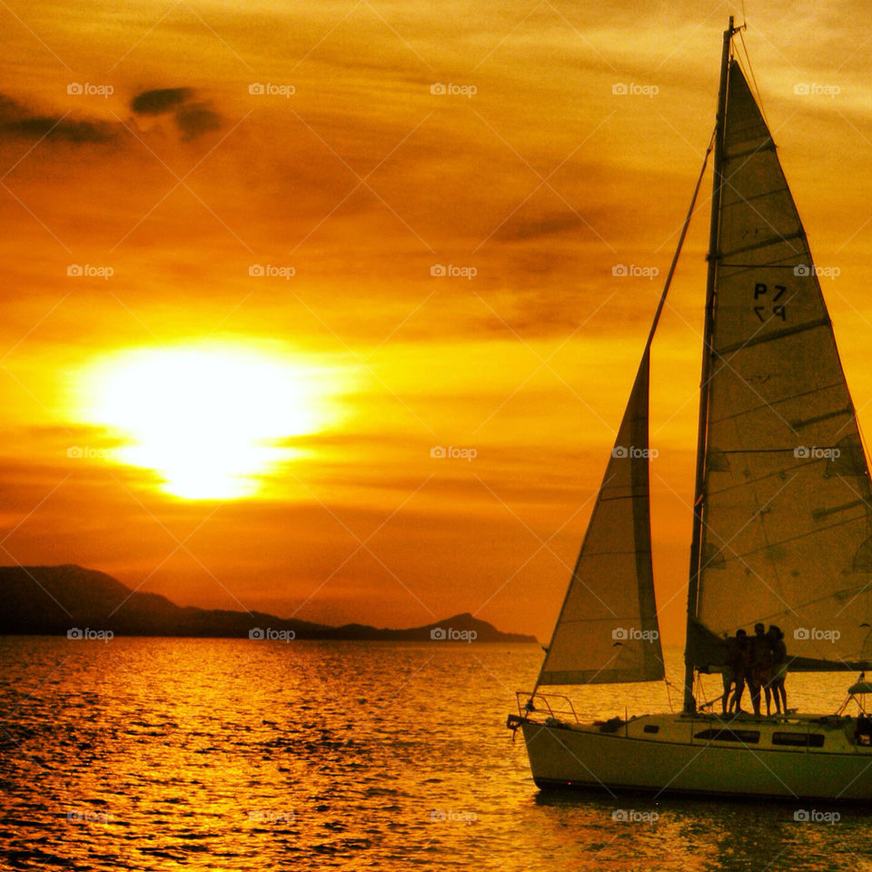 sunset orange sailboat by pixelate