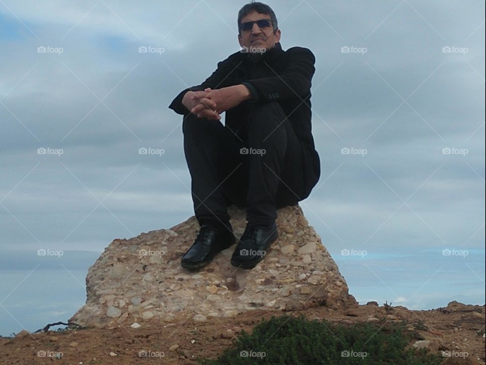 Im sitting on a rock near the beach at essaouira city in Morocco..