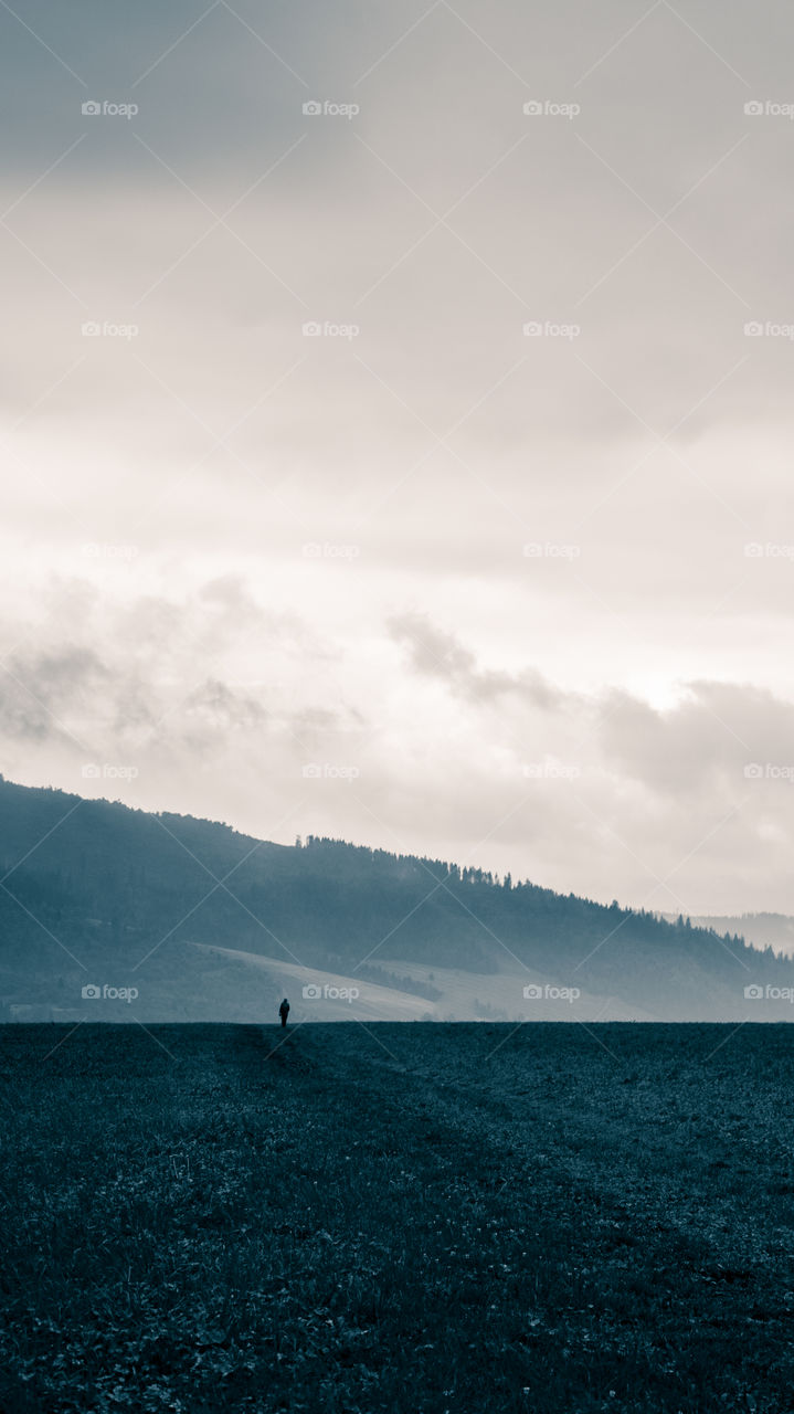 An inspiring mountain landscape. Tatry mountains in Slovakia. A beautiful wallpaper for smartphone screen. Monochrome blue abstract gradient with perspective.