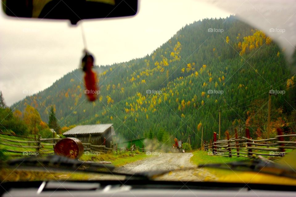 Riding the car in autumn mountains 