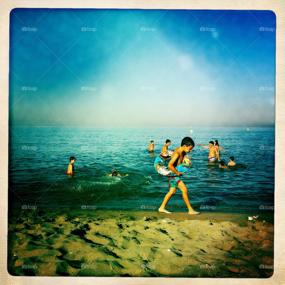 beach children play sand by inmacasado