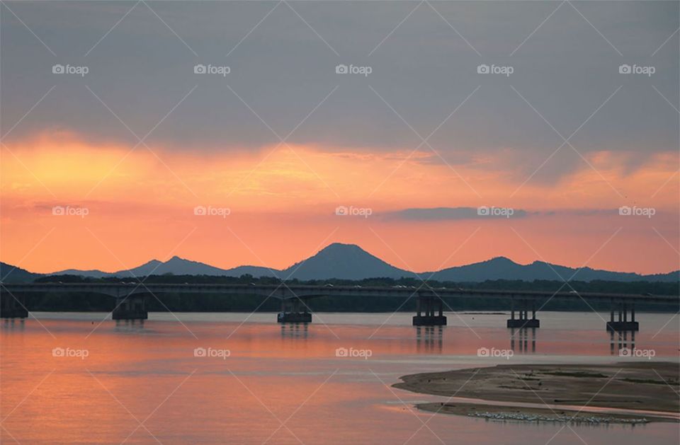sunset over the mountain with view of bridge