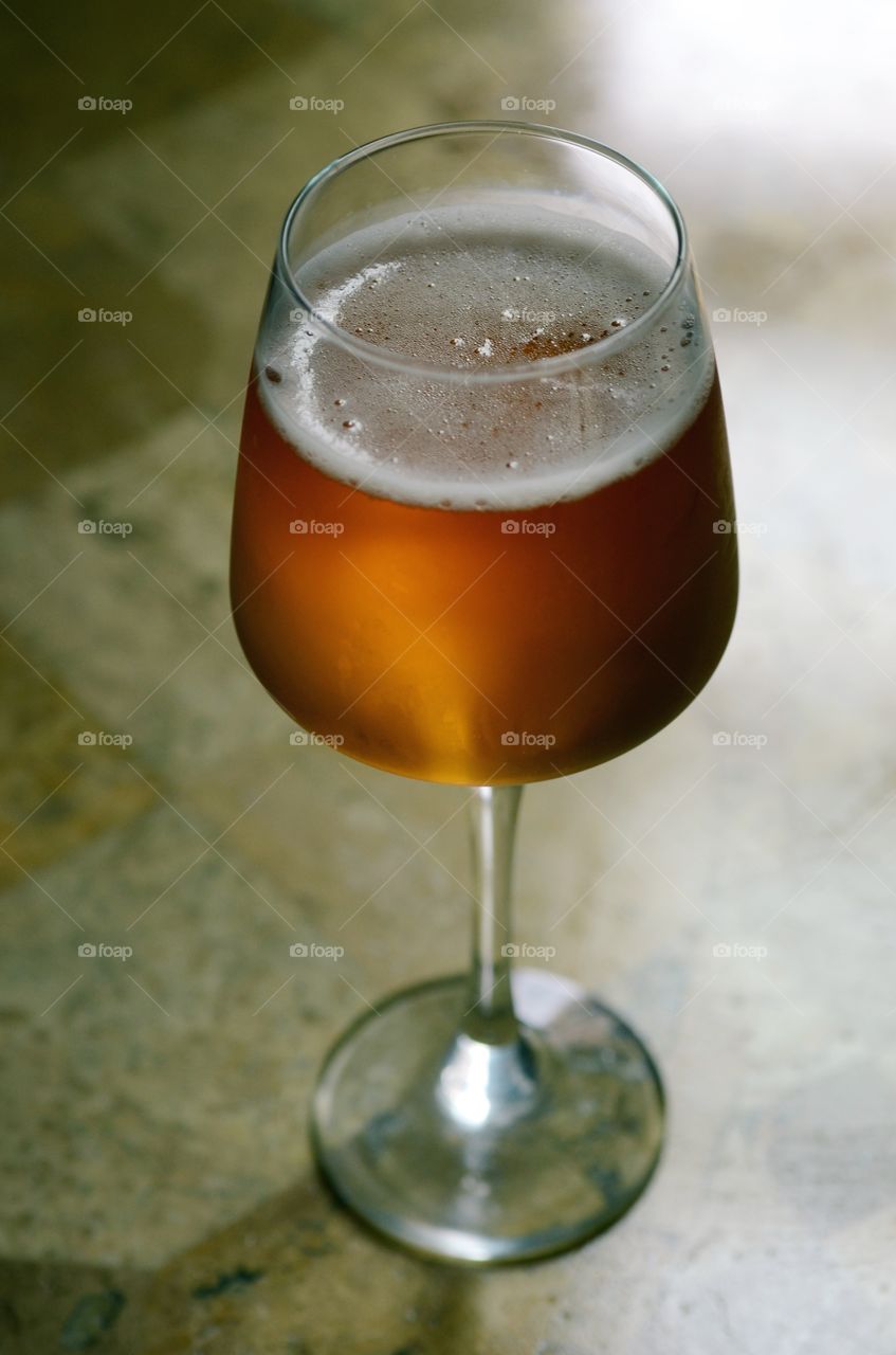 A closeup of a cold glass of beer.