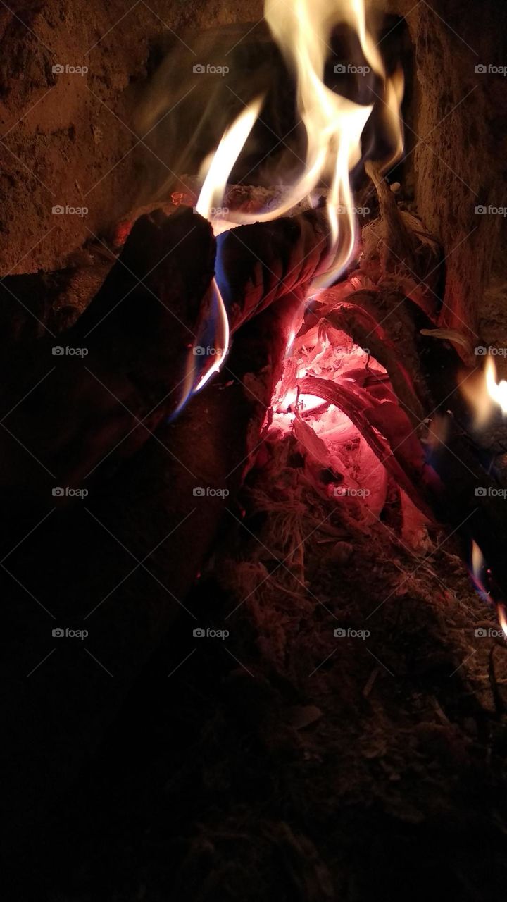 Photo of a burning and smoldering fire.