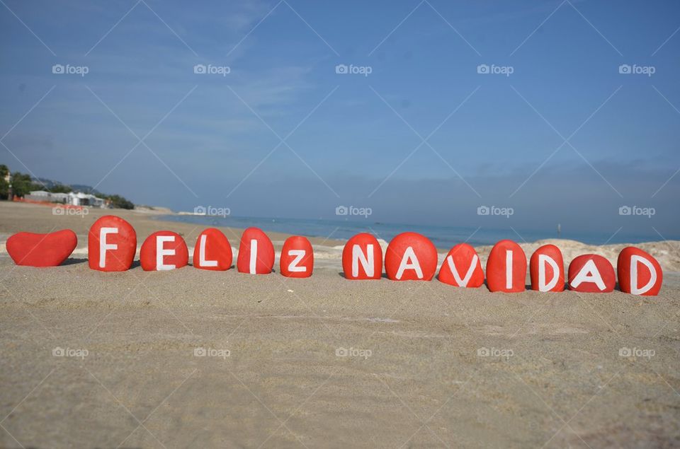 Feliz Navidad on colourful stones