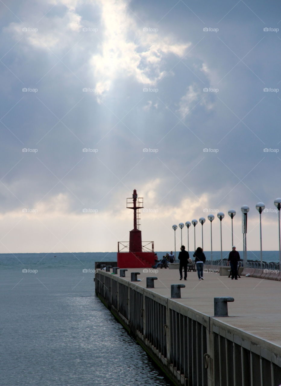 Tourist on pier over sea