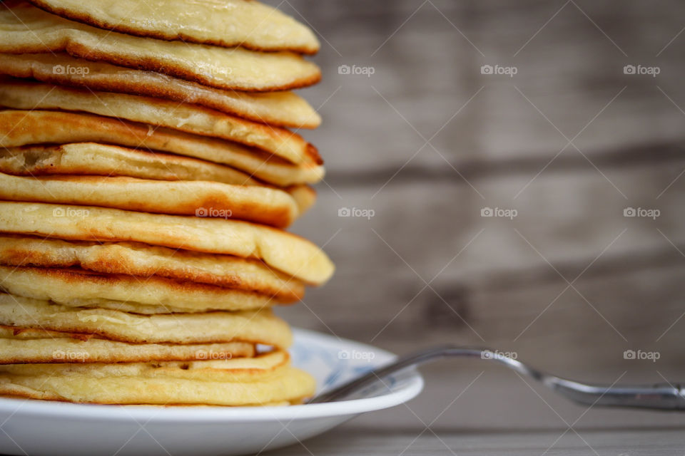 Pile of freshly made pancakes on a plate