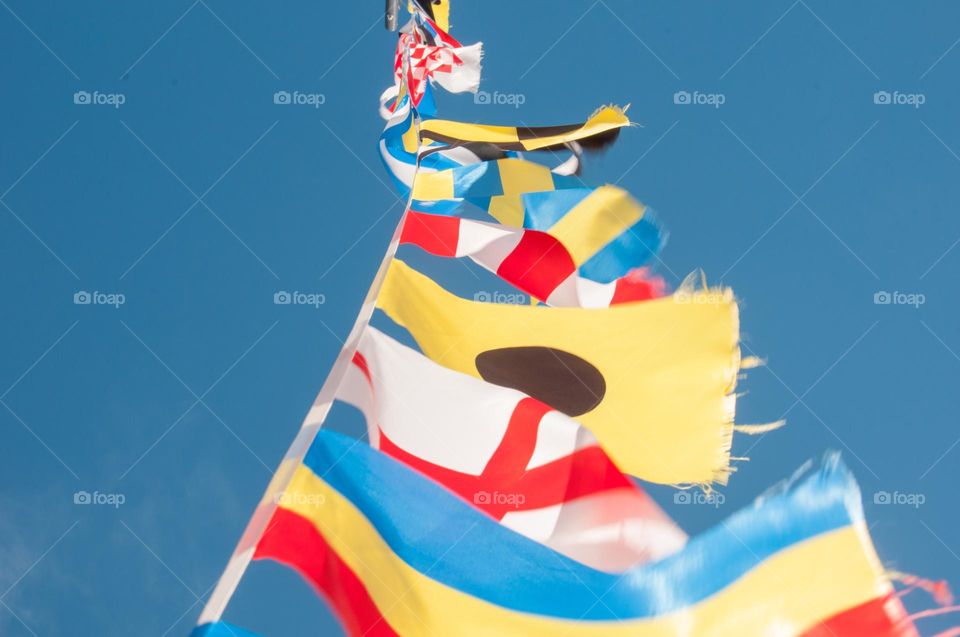 Different flags are fluttering in the wind. Nationality. Colorful backgrounds 