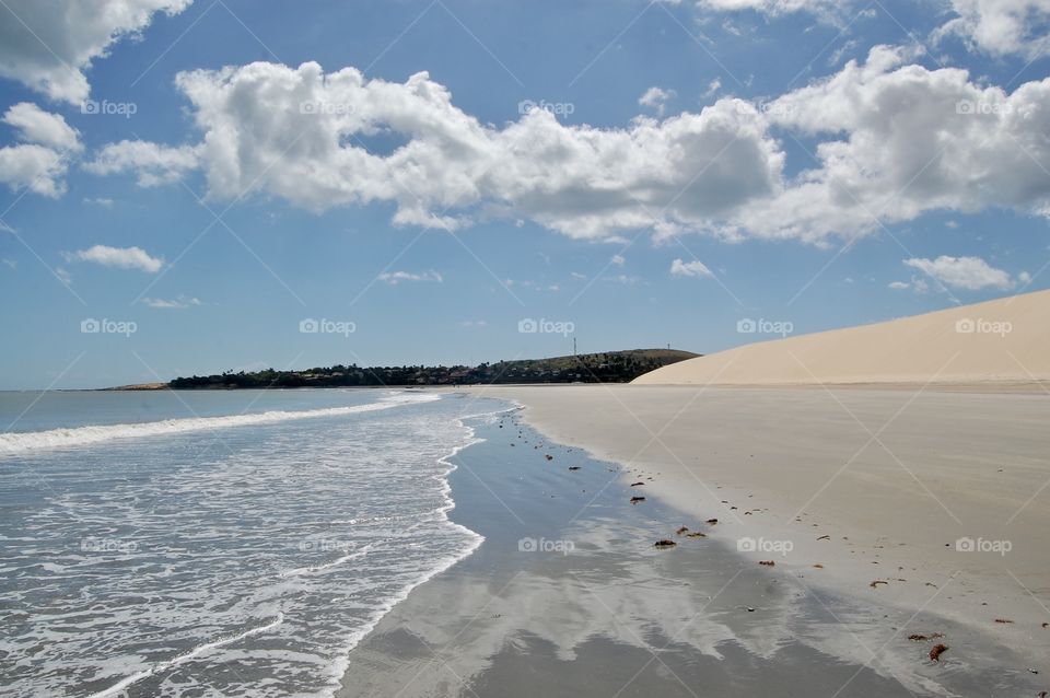 White dune near the sea before a fisher village 