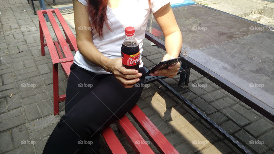 enjoying the game with Coca Cola