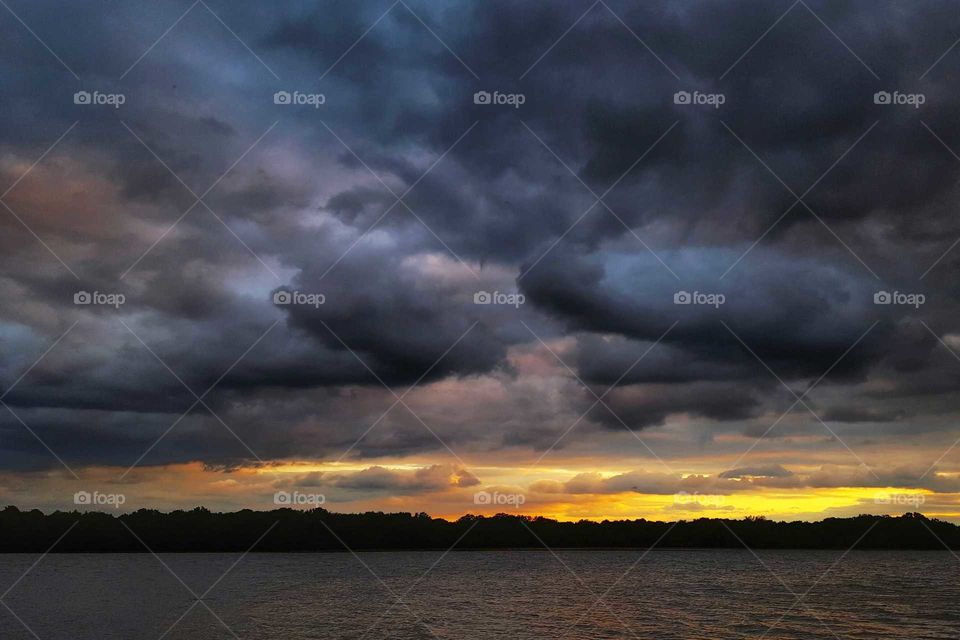 Beautiful clouds over calm sea water