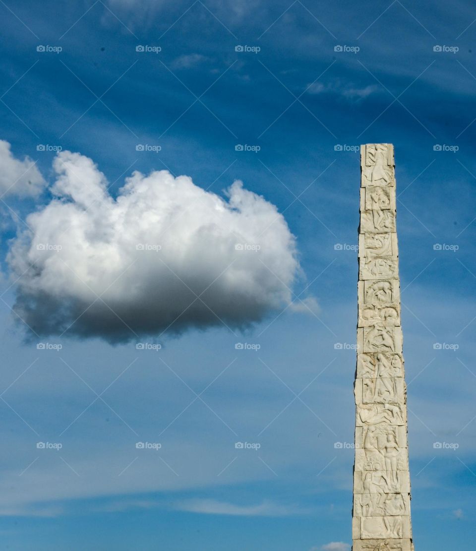 Obelisk and clouds