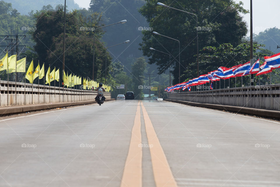 Road on the bridge with flag