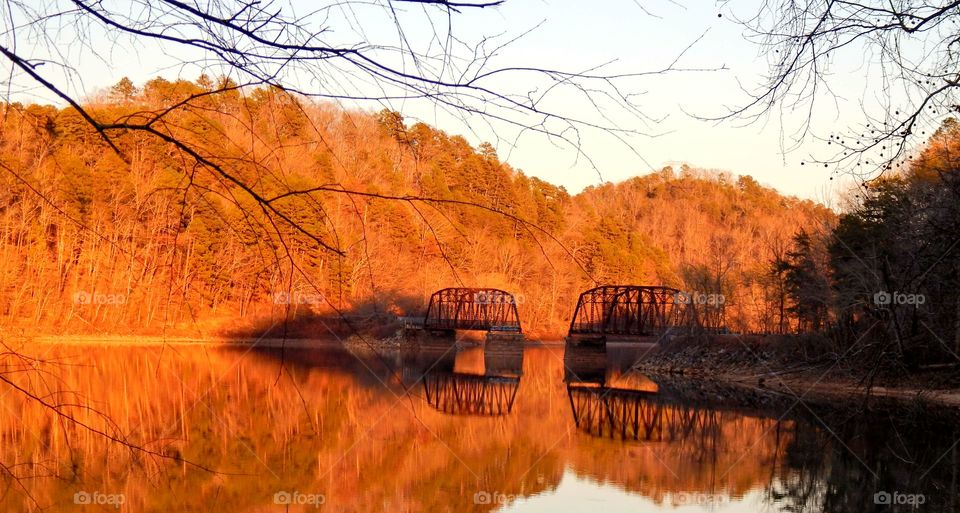 Golden sunset with spectacular reflections on lake Hartwell from the Georgia side