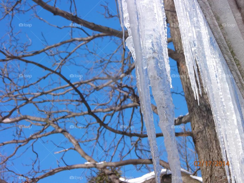 Icicle. icicle hanging down from the gutter