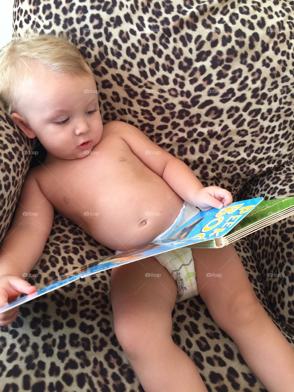 My grandson reading a book