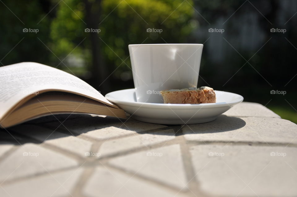 Reading time in the garden with a coffee